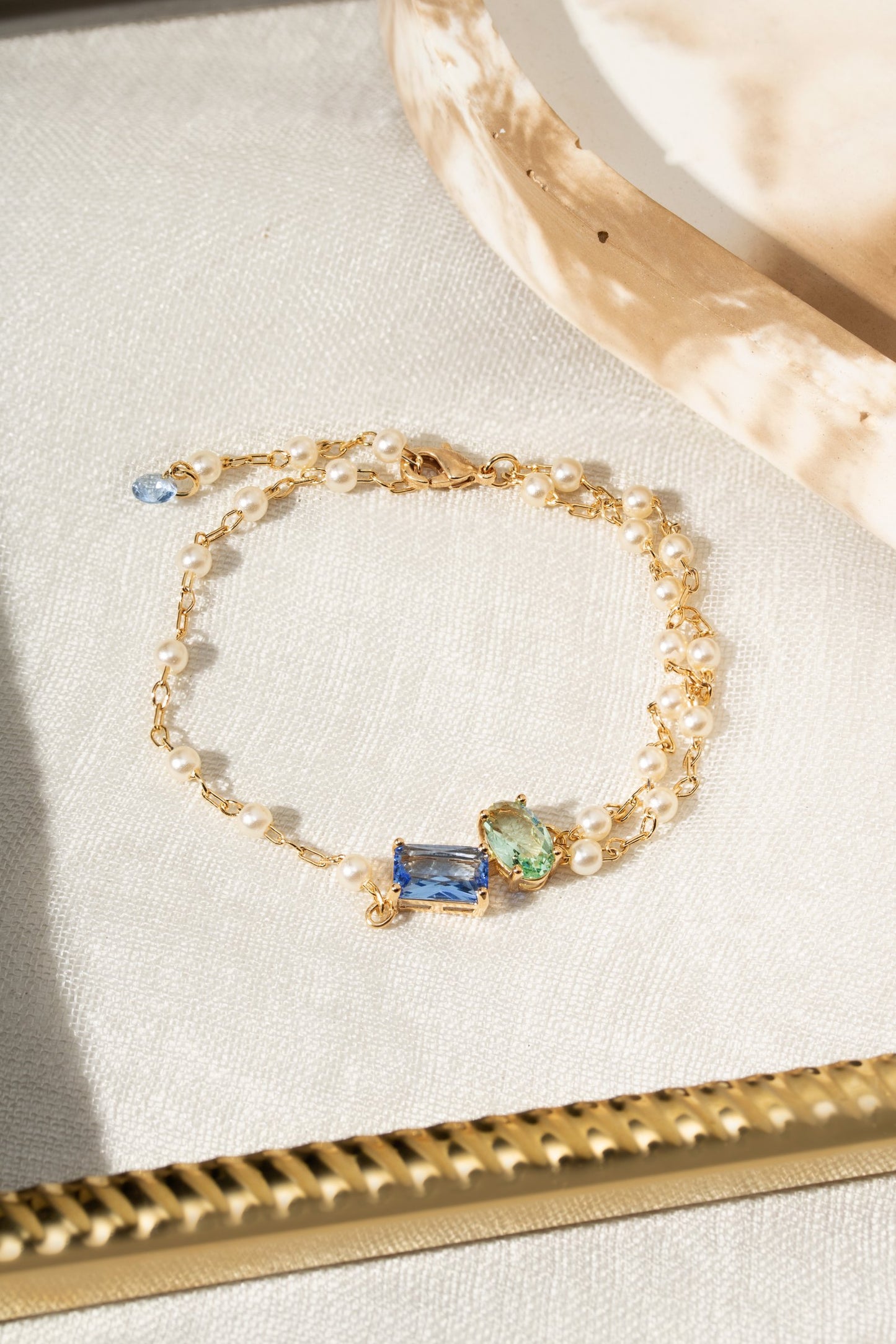 Gold bracelet with gemstones and pearls